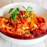 Delicious Tartufo seafood pasta with fresh herbs and rich tomato sauce. Perfect for gourmet Italian dining.